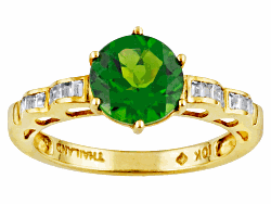 Chrome diopside 1.75ct round with white zircon .25ctw baguette 10k yellow gold ring. Measures approximately 5/16"L x 1/16"W.